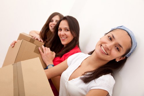Professional movers handling furniture packing