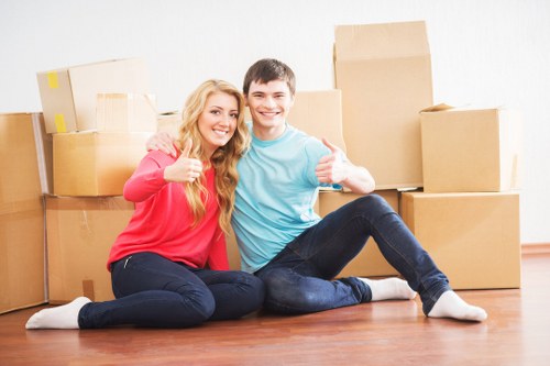 Professional movers handling furniture