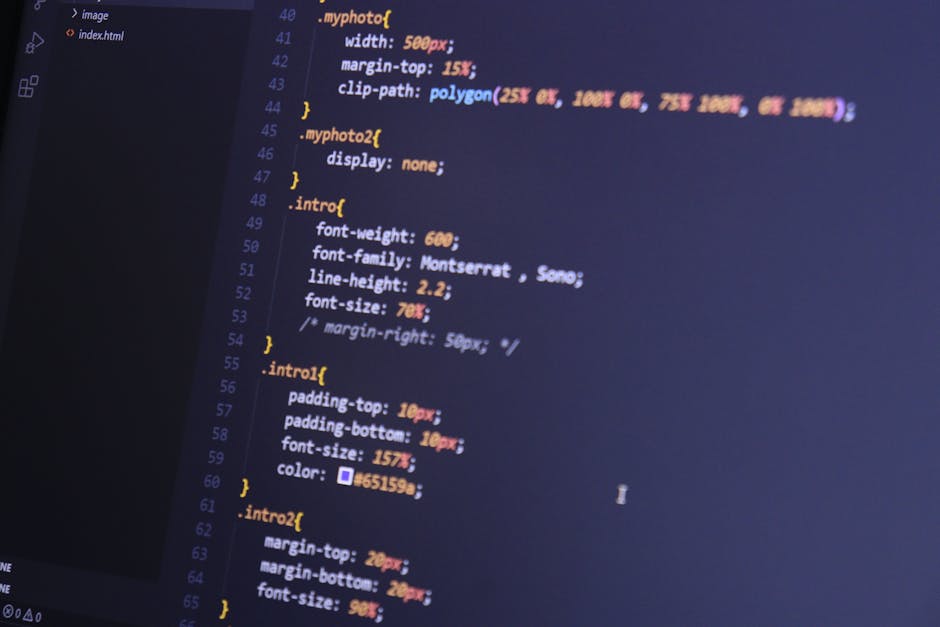 A computer screen displaying a code editor with colorful lines of CSS code, including font-weight, font-family, line-height, and padding settings, on a dark background. The screen is angled, showing t
